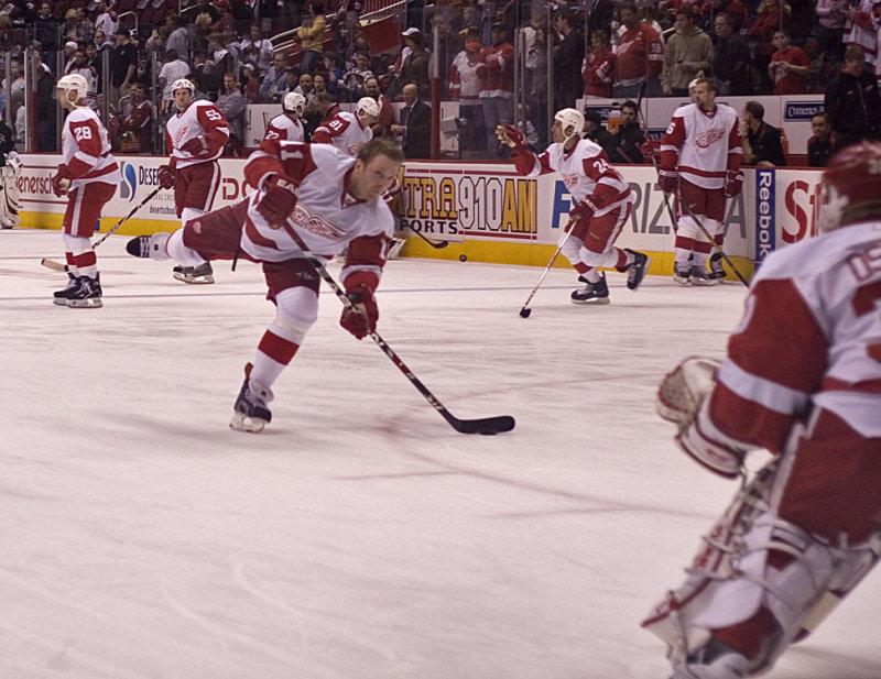 Cleary Shoots While Chris Chelios Points To a Fan