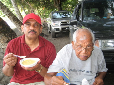 Uncle Carl and Grandpa enjoying Granny's famous corn porridge