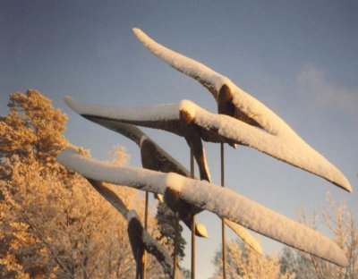 A bird statue in winter