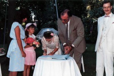 Jasmine signing the wedding papers on the left Joanne and Carmella