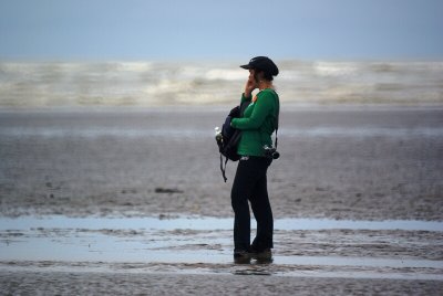 Girl on phone at beach