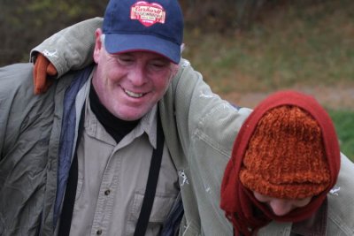 Don helping Dawn to the top of the dam