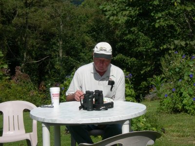 Jerry, having lunch with binoculars close by