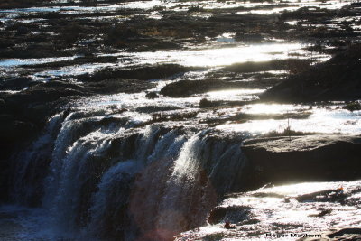 The sun reflecting on Sandstone Falls