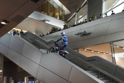 Trials biker ascending staircase
