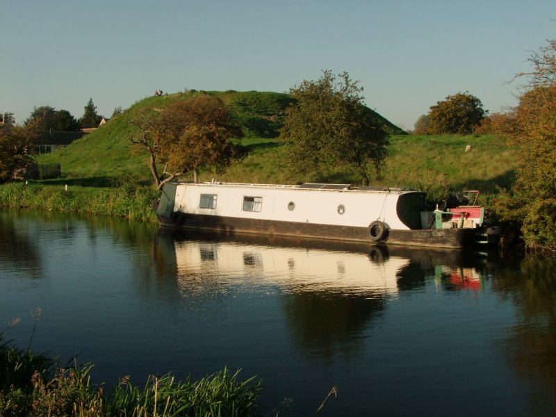Canal  boat  reflected  on  the  River  Nene.
