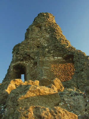 Sunlight plays on the tower's remains.