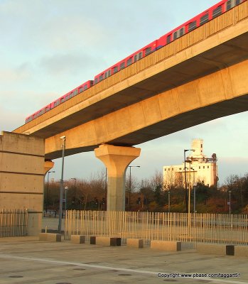 DLR train departing Pontoon Dock station