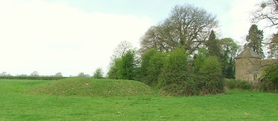Leysters motte,with adjacent St.Andrew's church building.