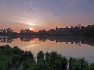 The sun rising over The Mere