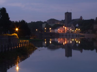 St.Mary's Church tower,with local street lights reflect in the Pembroke River.
