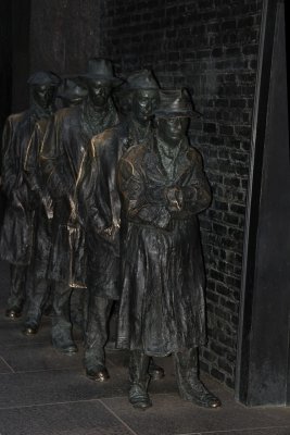 Men in line statue vertical.jpg