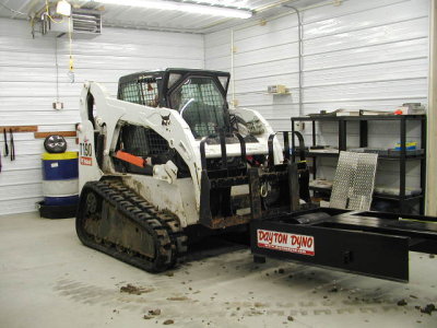 Rented a bobcat to lift the 1400lb dyno into place.JPG