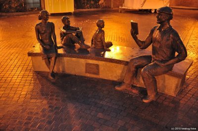 Statue of Ken Kesey reading to kids