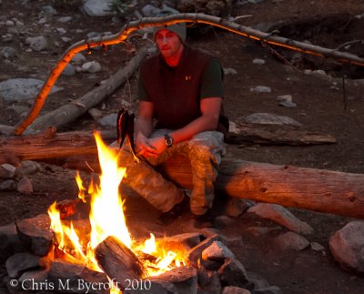 Another tramper (hiker) cooking trout over fire