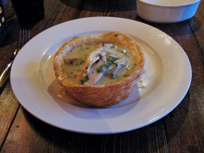 Old-fashioned chicken pie with mushrooms and a pastry lid
