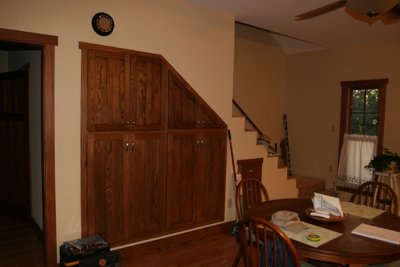 Breakfast area under stair cabinets & unfinished stairs