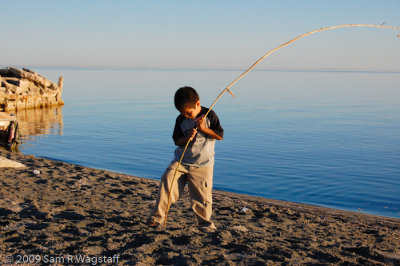 Kid fishing at the Salton Sea..