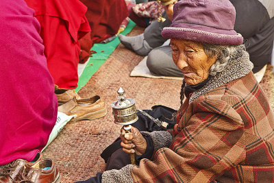 Tibetan with prayer wheel