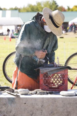 Later, a stonecutter demonstrates his craft,