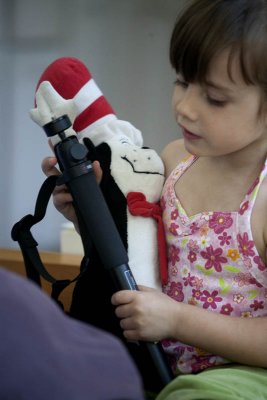 Playing with Grammie's Monopod and her Cat in the Hat doll.