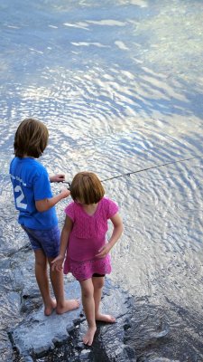 June 25: We look out front and some girls are fishing.