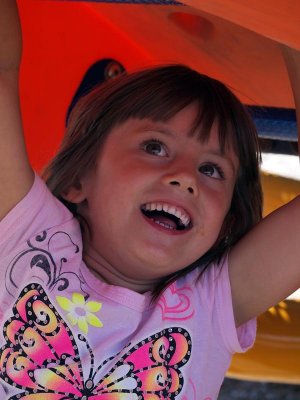 Then Lorelei tries out the monkey bars.