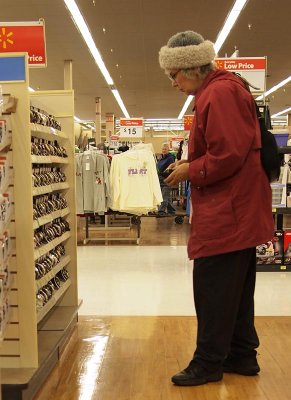A shopper agonizes over her choice. Don't worry, Lady! It's the thought that counts, so they say!