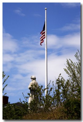 The Civil War statue in Camden turns his back to the American Flag.
