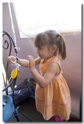 Lorelei stays busy singing 'Working on the Railroad and tying balloon strings.