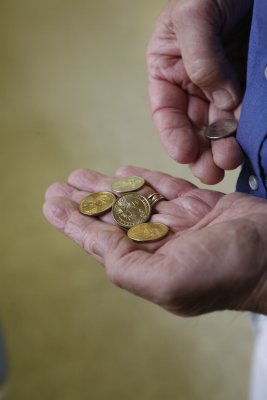 ....get golden dollars in change for his $5.00 deposit.