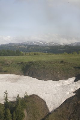 As we get closer, we realize that they still have snow in places.