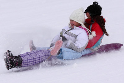 Girls Sliding Down The Hill