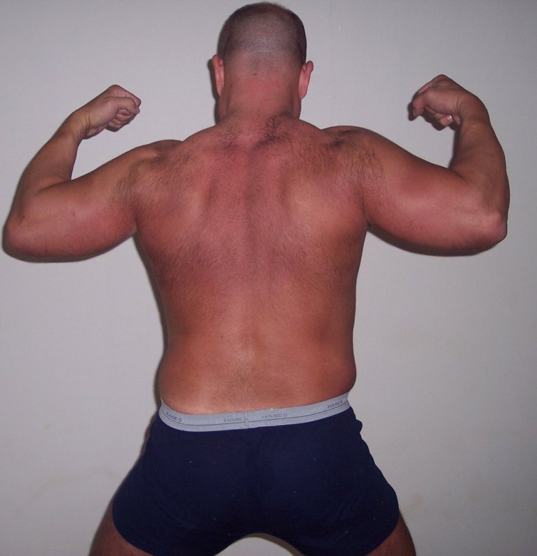 kinky restraints wrestler man flexing arms