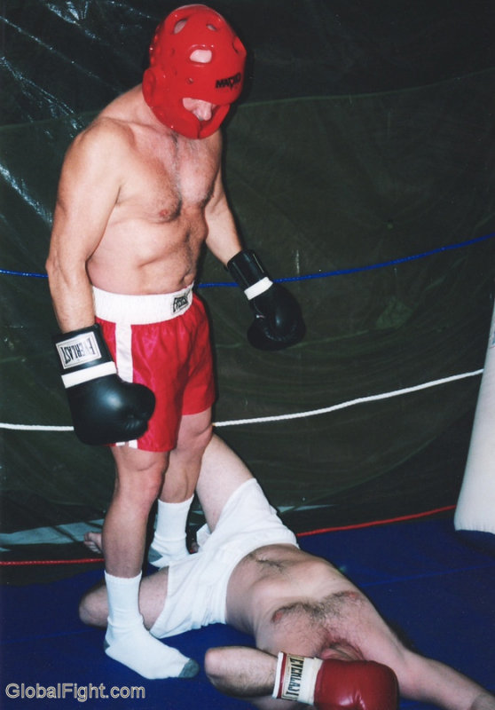 boxer standing over knocked out loser.JPG