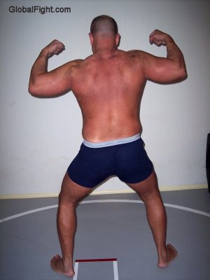 shirtless man flexing.jpg