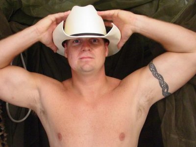 cowboy flexing nude.jpeg