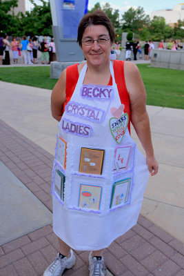 Becky and her friends wear aprons to display their swap cards.