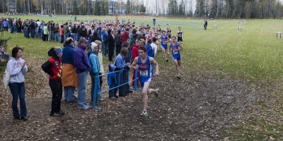 The boys 1A, 2A, 3A round the first turn