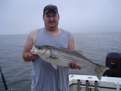 9/23/2009 Riley Family Charter - Ken with nice 30 Striper