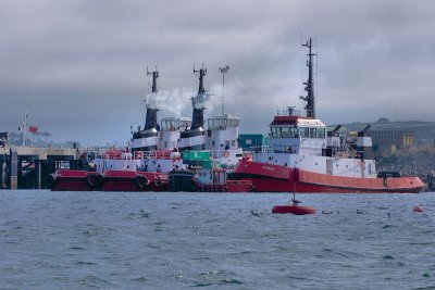 Tugs ready to go on a windy day  in Falmouth docks