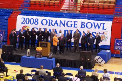 Orange Bowl rep congratulating Coach