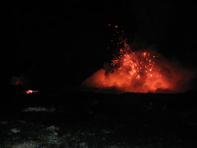 Flowing lava on L, ocean-entry action on right