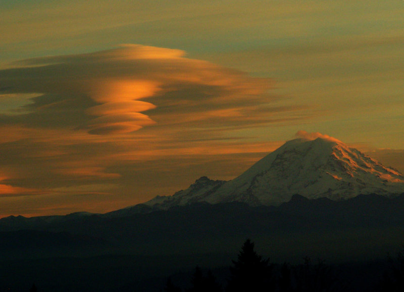 Lenticular clouds blown off Mt. Rainier, taken from Cougar Mountain at sunset