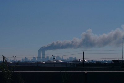 New Jersey turnpike shot of the World Trade Center as the second plane hit 9-11-2001  A sad day for the world.jpg