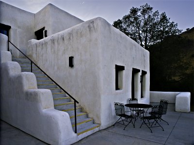 Stairs, room, and patio at twilight