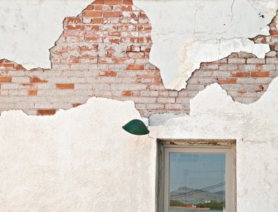 Lamp, plaster, bricks and a window