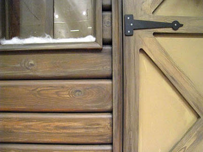 detail - faux wood on cabin for window display