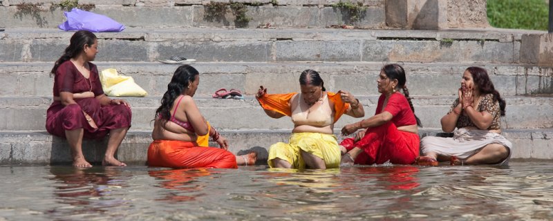 Ladies taking a  bath