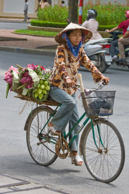 Lady with lotus flowers on bike (Hanoi)